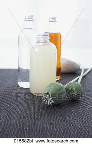 still life of poppy and three cosmetic bottles View Large Photo Image Stock Image - still life of poppy and three cosmetic bottles. Fotosearch