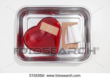 still life of red heart covered with band-aid in silver bowl View Large Photo Image Stock Image - still life of red heart covered with band-aid in silver bowl. Fotosearch