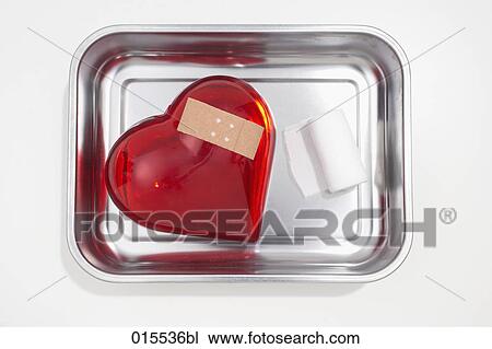 still life of red heart covered with band-aid in silver bowl View Large Photo Image Stock Image - still life of red heart covered with band-aid in silver bowl. Fotosearch