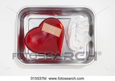still life of red heart covered with band-aid in silver bowl View Large Photo Image Stock Image - still life of red heart covered with band-aid in silver bowl. Fotosearch