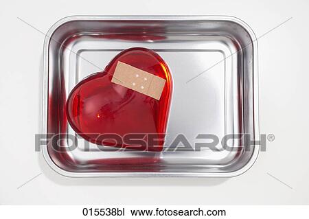 still life of red heart covered with band-aid in silver bowl View Large Photo Image Stock Image - still life of red heart covered with band-aid in silver bowl. Fotosearch