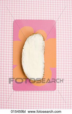 Stock Image - still life of slice of bread with butter. Fotosearch
