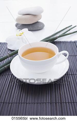 still life of tea cup orchid and pebbles View Large Photo Image Stock Image - still life of tea cup orchid and pebbles. Fotosearch
