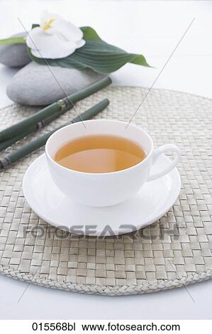 still life of tea cup with orchid on pebble in background View Large Photo Image Stock Image - still life of tea cup with orchid on pebble in background. Fotosearch