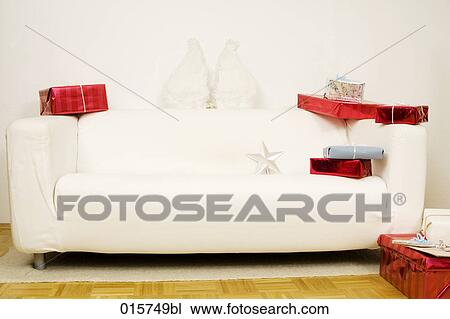 still life of white sofa decorated with christmas presents View Large Photo Image Stock Image - still life of white sofa decorated with christmas presents. Fotosearch