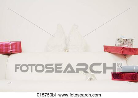 still life of white sofa decorated with christmas presents View Large Photo Image Stock Image - still life of white sofa decorated with christmas presents. Fotosearch