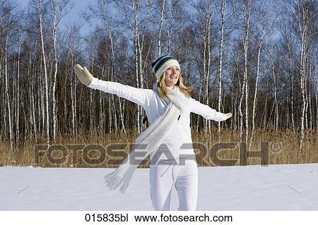 teenage girl happily dancing outdoors in winter View Large Photo Image Stock Image - teenage girl happily dancing outdoors in winter. Fotosearch