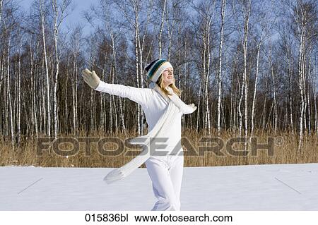 teenage girl happily dancing outdoors in winter View Large Photo Image Stock Image - teenage girl happily dancing outdoors in winter. Fotosearch