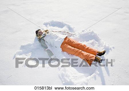 teenage girl making snow angel View Large Photo Image Stock Image - teenage girl making snow angel. Fotosearch