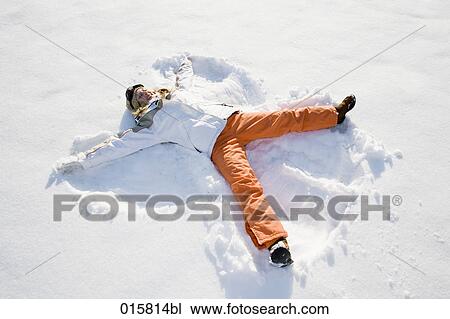 teenage girl making snow angel View Large Photo Image Stock Image - teenage girl making snow angel. Fotosearch