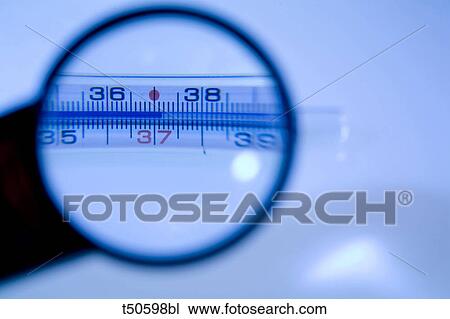 Thermometer seen through a magnifying glass View Large Photo Image Stock Image - Thermometer seen through a magnifying glass. Fotosearch