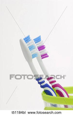 Toothbrushes in a glass View Large Photo Image Stock Image - Toothbrushes in a glass. Fotosearch