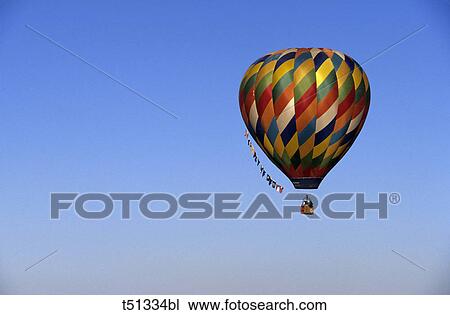 Stock Image - USA, New Mexico, Albuquerque, hot air balloon in flight. Fotosearch