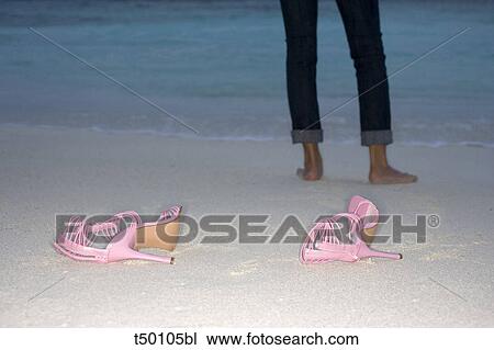 Woman and high heels on beach View Large Photo Image Stock Image - Woman and high heels on beach. Fotosearch