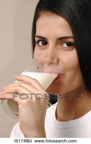 Woman drinking milk View Large Photo Image Stock Image - Woman drinking milk. Fotosearch