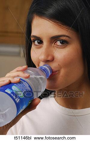 Woman drinking water View Large Photo Image Stock Image - Woman drinking water. Fotosearch