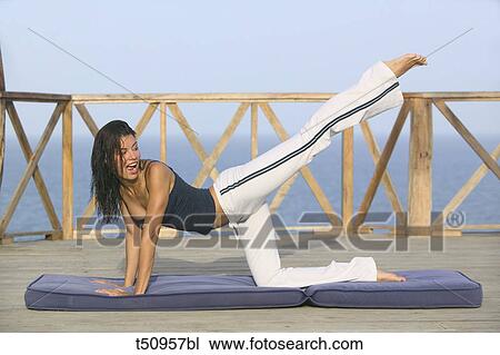 Woman exercising View Large Photo Image Stock Image - Woman exercising. Fotosearch