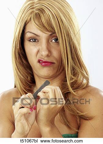 Woman filing nails View Large Photo Image Stock Image - Woman filing nails. Fotosearch