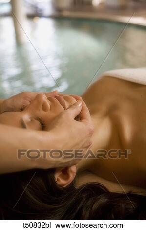 Woman getting a face massage View Large Photo Image Stock Image - Woman getting a face massage. Fotosearch