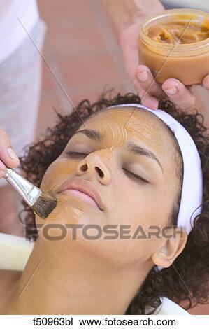 Woman getting face mask View Large Photo Image Stock Image - Woman getting face mask. Fotosearch