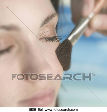 Woman getting made up View Large Photo Image Stock Image - Woman getting made up. Fotosearch