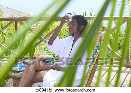 Woman having breakfast outdoors View Large Photo Image Stock Image - Woman having breakfast outdoors. Fotosearch