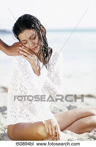 Stock Image - Woman holding man's hand. Fotosearch