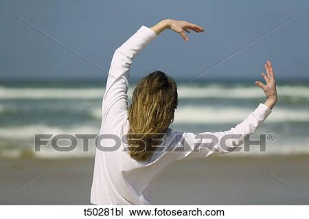 Woman in yoga position from behind View Large Photo Image Stock Image - Woman in yoga position from behind. Fotosearch