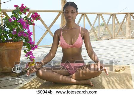 Woman meditating View Large Photo Image Stock Image - Woman meditating. Fotosearch