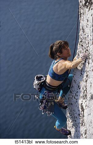 Woman rock climbing View Large Photo Image Stock Image - Woman rock climbing. Fotosearch