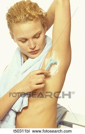 Woman shaving her armpit View Large Photo Image Stock Image - Woman shaving her armpit. Fotosearch