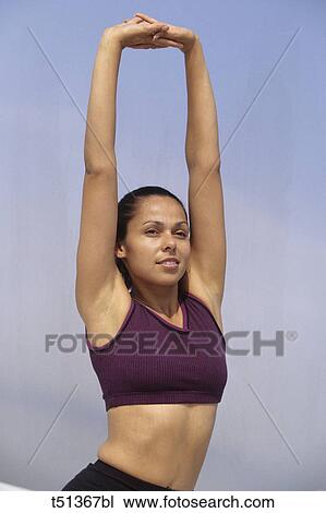 Stock Image - Woman stretching. Fotosearch