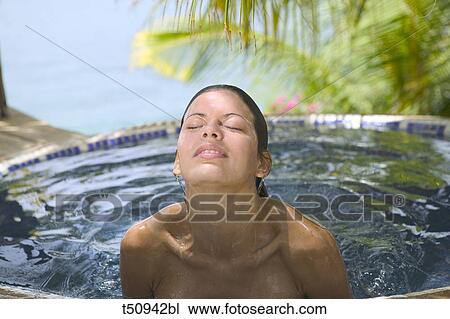Woman surfacing from swimming pool View Large Photo Image Stock Image - Woman surfacing from swimming pool. Fotosearch