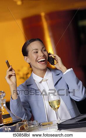 Stock Image - Woman talking on mobile phone. Fotosearch