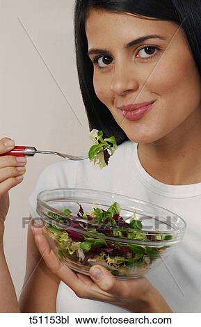 Woman with a bowl of salad View Large Photo Image Stock Image - Woman with a bowl of salad. Fotosearch