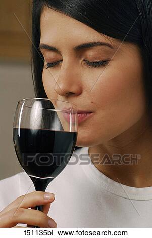 Woman with a glass of red wine View Large Photo Image Stock Image - Woman with a glass of red wine. Fotosearch