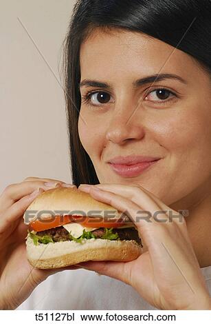 Woman with hamburger View Large Photo Image Stock Image - Woman with hamburger. Fotosearch