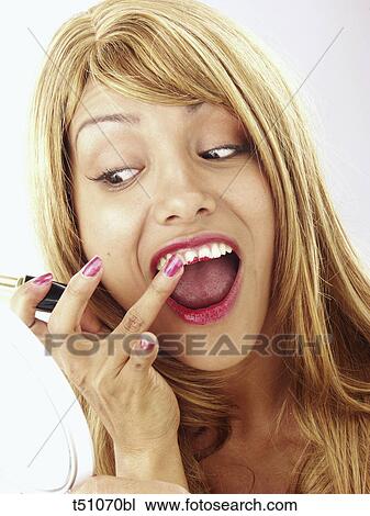 Woman with lipstick on teeth View Large Photo Image Stock Image - Woman with lipstick on teeth. Fotosearch