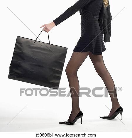 Woman with shopping bag View Large Photo Image Stock Image - Woman with shopping bag. Fotosearch