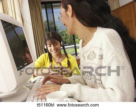Stock Image - Woman working at home. Fotosearch