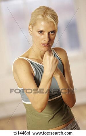 Woman working out in fitness studio View Large Photo Image Stock Image - Woman working out in fitness studio. Fotosearch