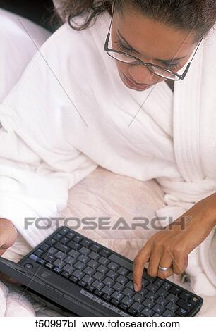 Woman working with laptop View Large Photo Image Stock Image - Woman working with laptop. Fotosearch
