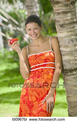 Woman's portrait with a fruit View Large Photo Image Stock Image - Woman's portrait with a fruit. Fotosearch
