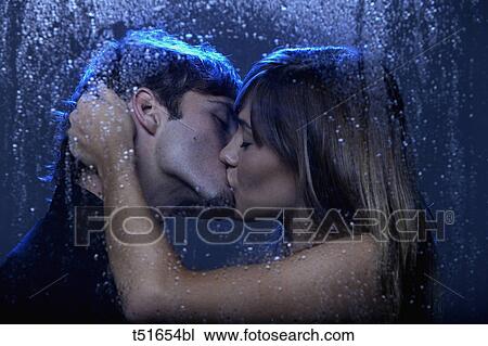 Young couple kissing behind a wet window View Large Photo Image Stock Image - Young couple kissing behind a wet window. Fotosearch