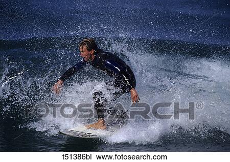 Young man surfing short board in San Diego, California, USA View Large Photo Image Stock Image - Young man surfing short board in San Diego, California, USA. Fotosearch