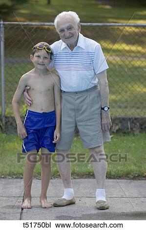 96 year old grandfather with 9 year old grandson at poolside View Large Photo Image Stock Image - 96 year old grandfather with 9 year old grandson at poolside . Fotosearch