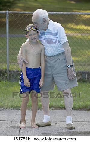 96 year old grandfather with 9 year old grandson at poolside View Large Photo Image Stock Image - 96 year old grandfather with 9 year old grandson at poolside . Fotosearch