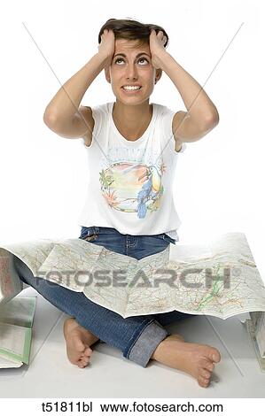 A hopeless woman looking for a map View Large Photo Image Stock Image - A hopeless woman looking for a map . Fotosearch
