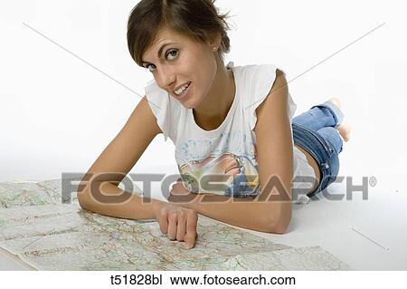 A young woman looking for a map View Large Photo Image Stock Image - A young woman looking for a map . Fotosearch
