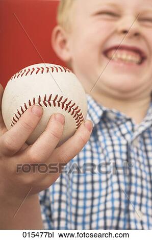 close-up of little boy holding baseball View Large Photo Image Stock Image - close-up of little boy holding baseball. Fotosearch